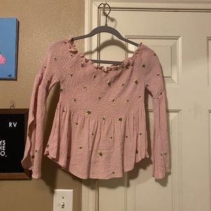pink blouse with yellow flowers